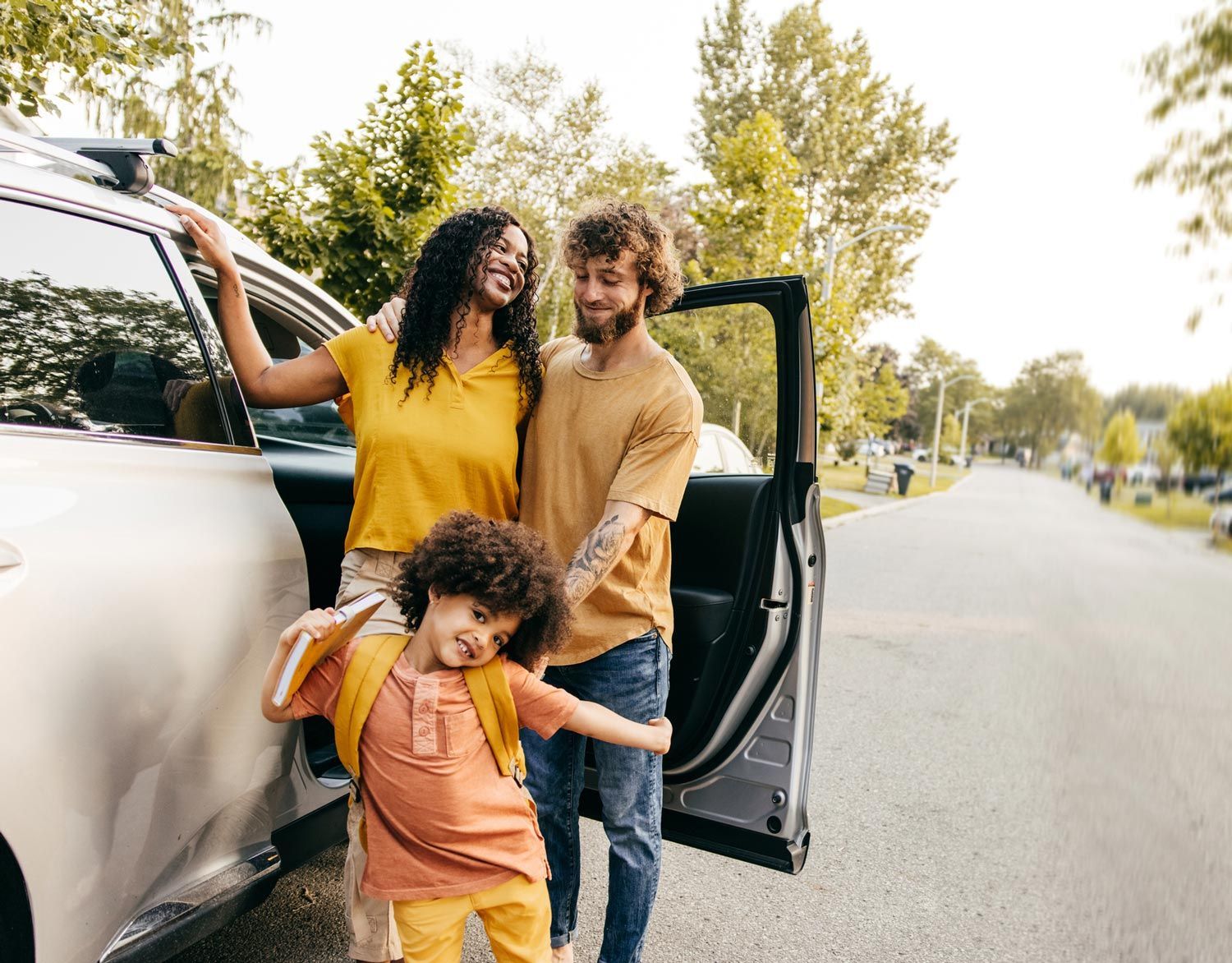 Family Beside Car — Hillsboro, TX — Lehmann Insurance Agency Family Beside Car — Hillsboro, TX — Lehmann Insurance Agency