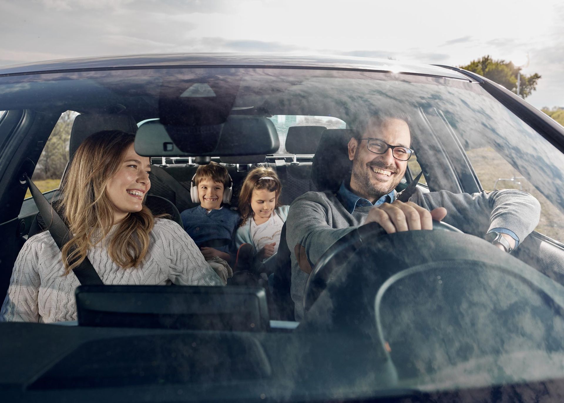 Happy Family In Car — Hillsboro, TX — Lehmann Insurance Agency Happy Family In Car — Hillsboro, TX — Lehmann Insurance Agency