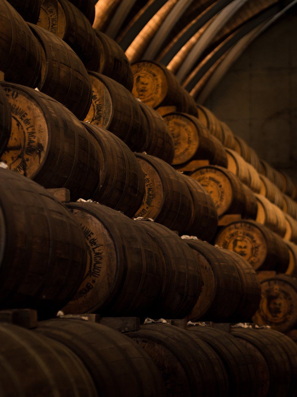 A bunch of barrels are stacked on top of each other