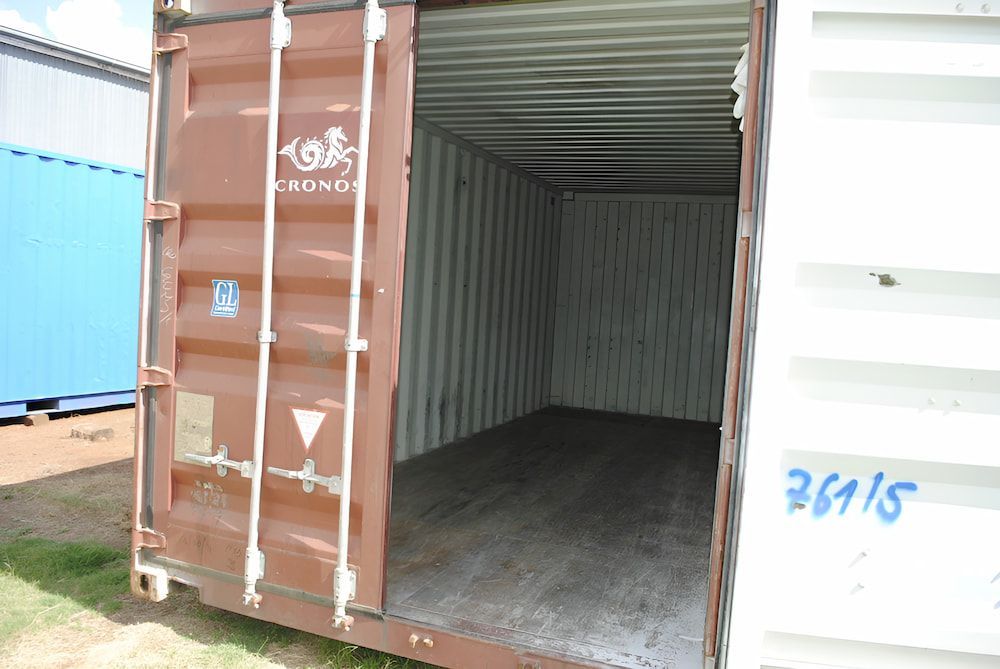 A Brown And White Shipping Container With The Door Open  — Ollies Towing & Shipping Container Sales in Kingaroy, QLD