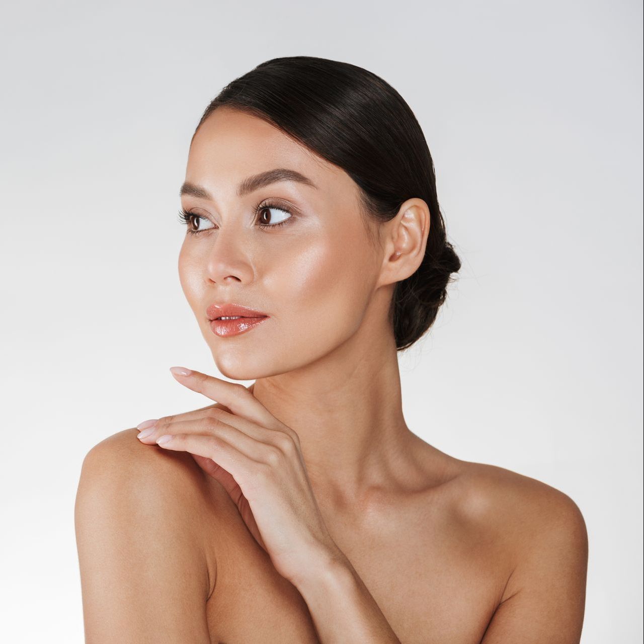 Woman with her hand on her chin at ERA Wellness Spa