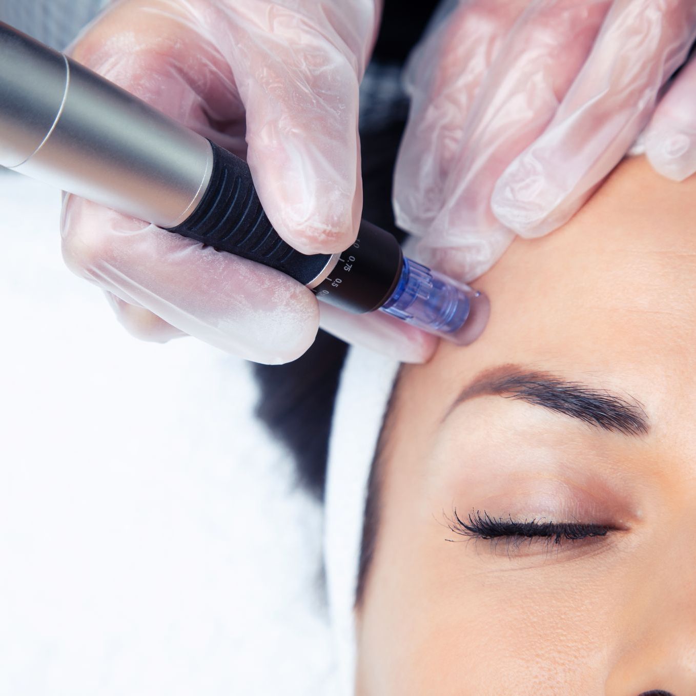 a woman is getting a facial treatment at ERA Wellness Spa