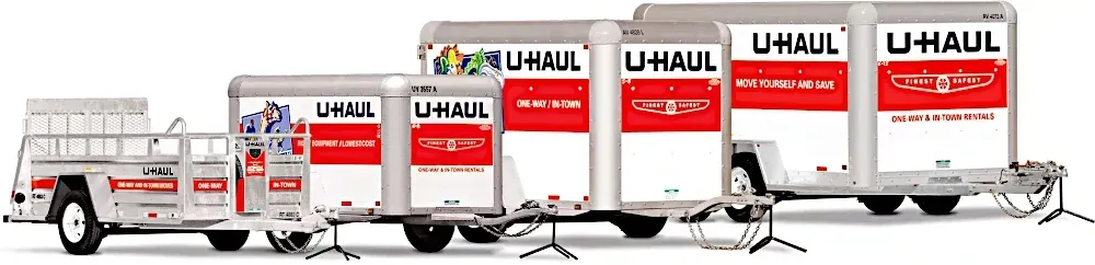 a row of uhaul trailers are parked next to each other