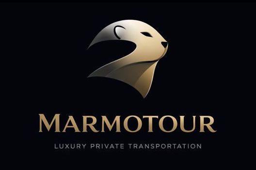 Logotipo: Cabeza de marmota dorada, texto 