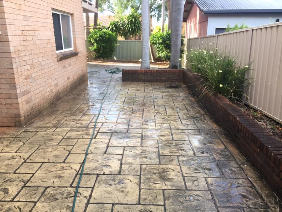 Brick Floor is Getting Clean by Pressure Cleaning — Hastings Services in Lake Cathie, NSW
