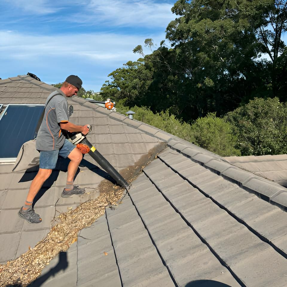 Man is Vacuuming the Roof of a House — Hastings Services in Port Macquarie, NSW