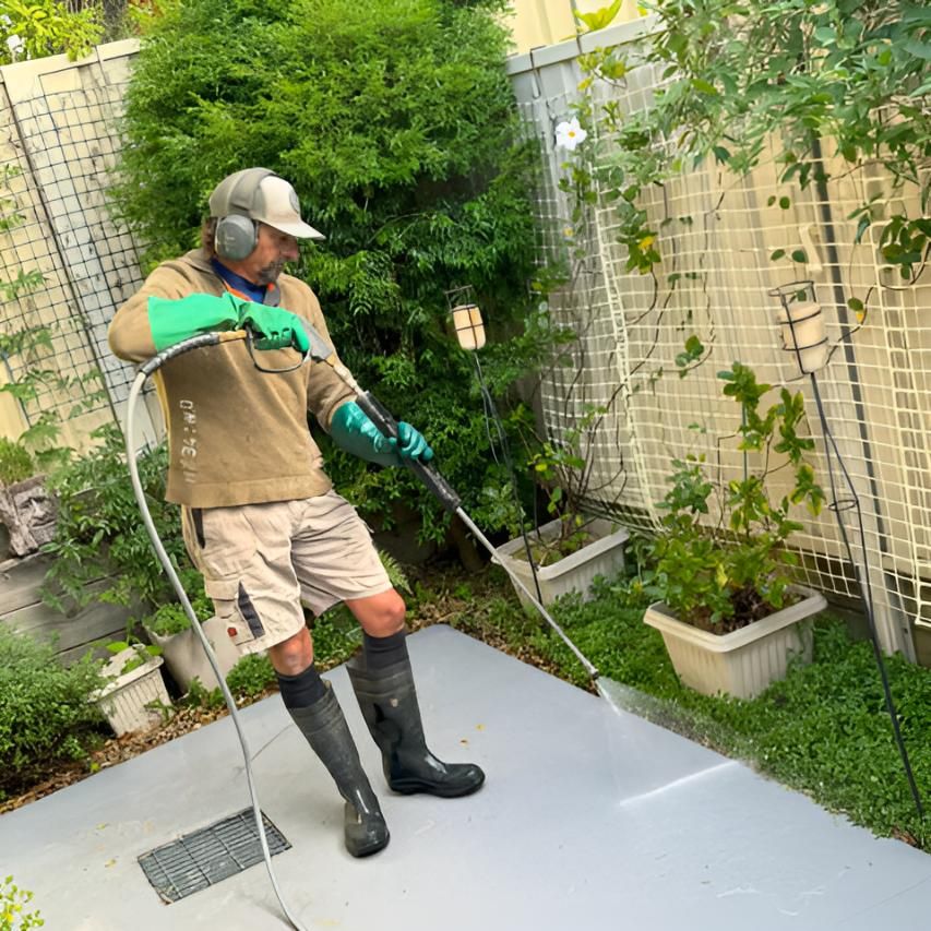 Man Cleaning Using Pressure Cleaning — Hastings Services in Port Macquarie, NSW
