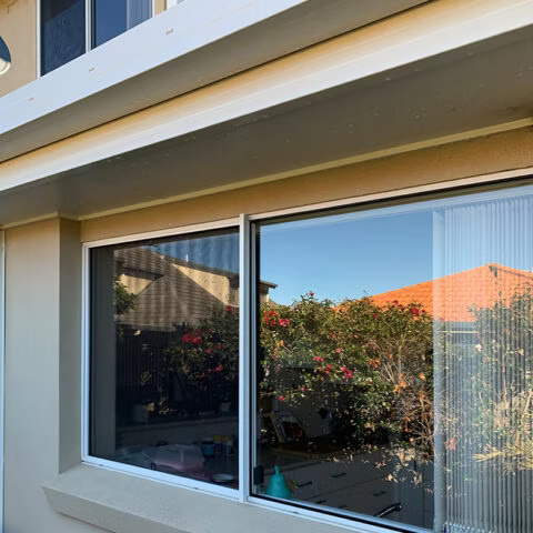 Clean House and Window with a reflection of trees — Hastings Services in Port Macquarie, NSW