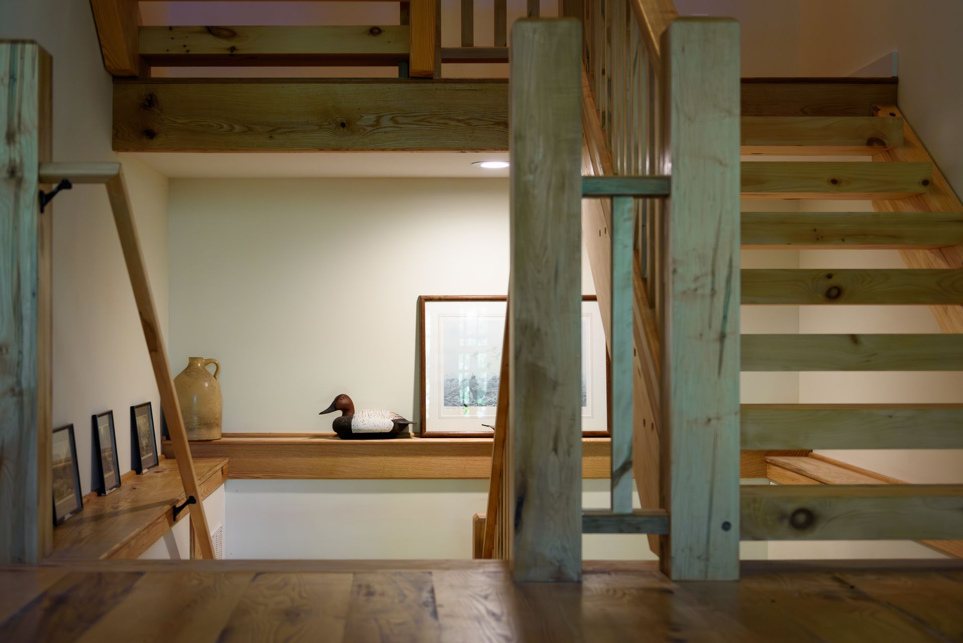 A wooden staircase leading up to the second floor of a house.