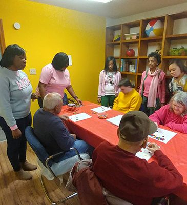 elderly people playing game on paper