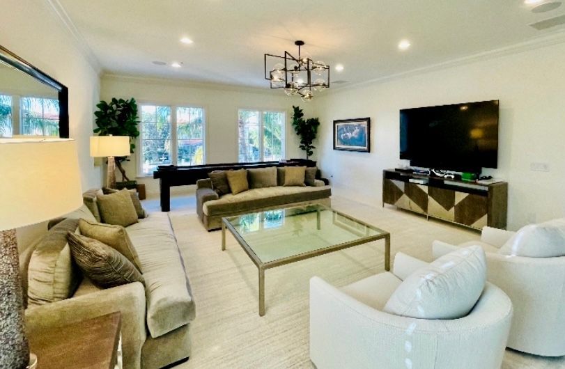 A living room filled with furniture and a flat screen tv