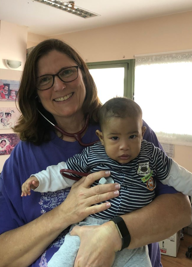 Leslie Holding a Baby — Roseburg, OR — Onesimus Health Services