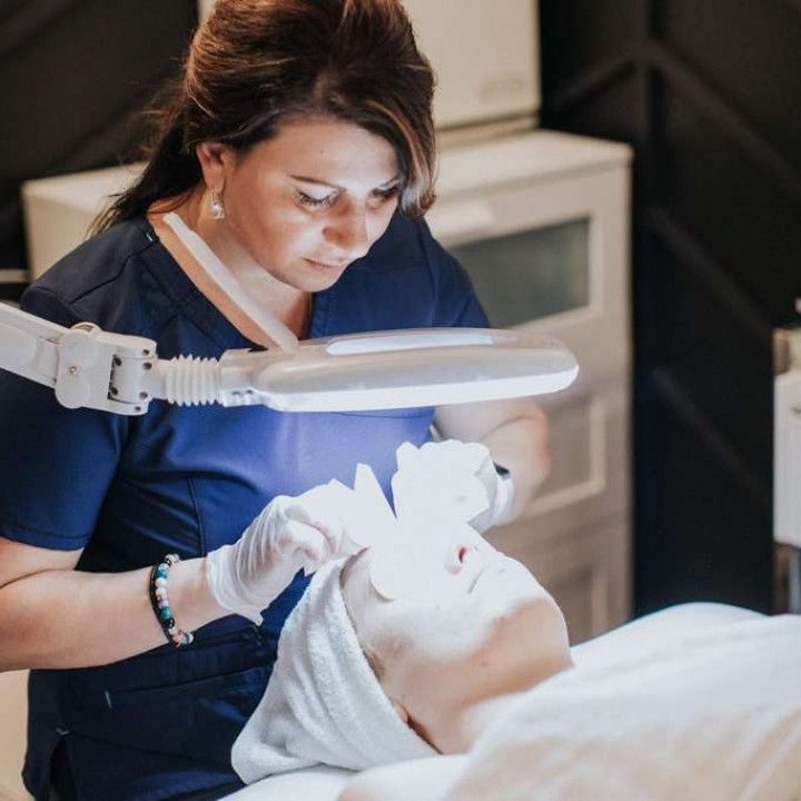 Lela completing facial treatments on a client in Evergreen, Colorado at Lela Skin Care and Facials