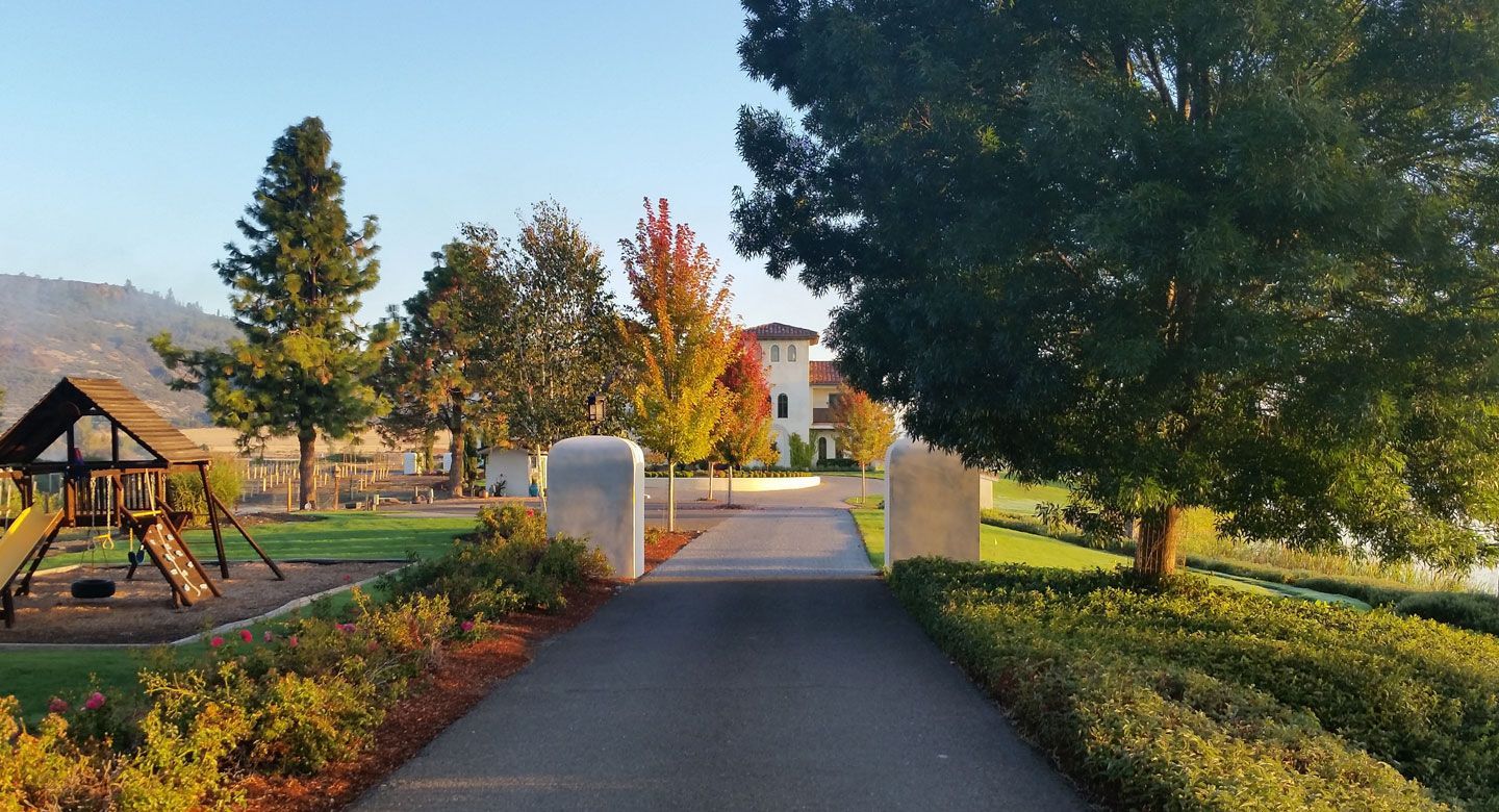 A path leading to a playground in a park