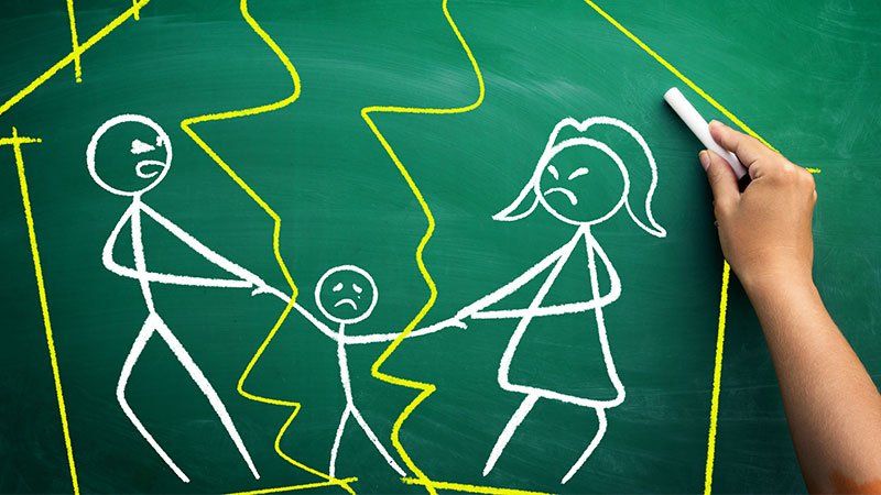 Chalk drawing of parents fighting over a child