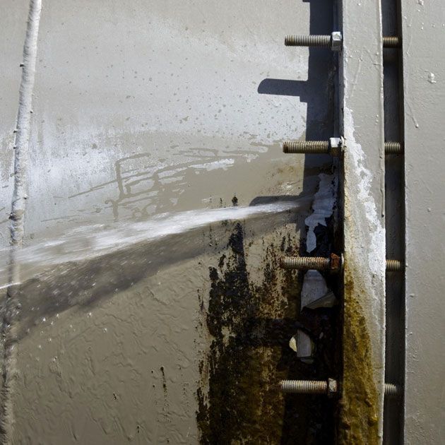 A Close Up of a Metal Pipe With Screws on It — Wigg Plumbing in Berrimah, NT