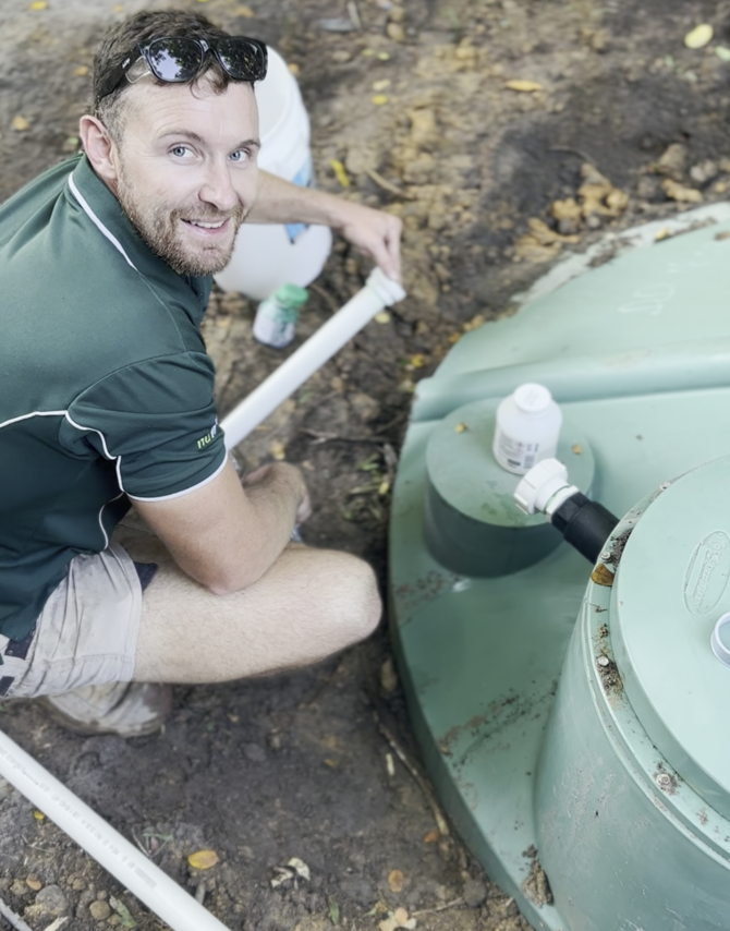 A Man working on septic tank — Wigg Plumbing in Berrimah, NT