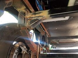 A close up of the underside of a vehicle.