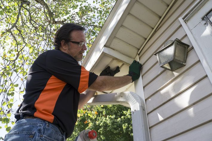 Siding installer with PPE on