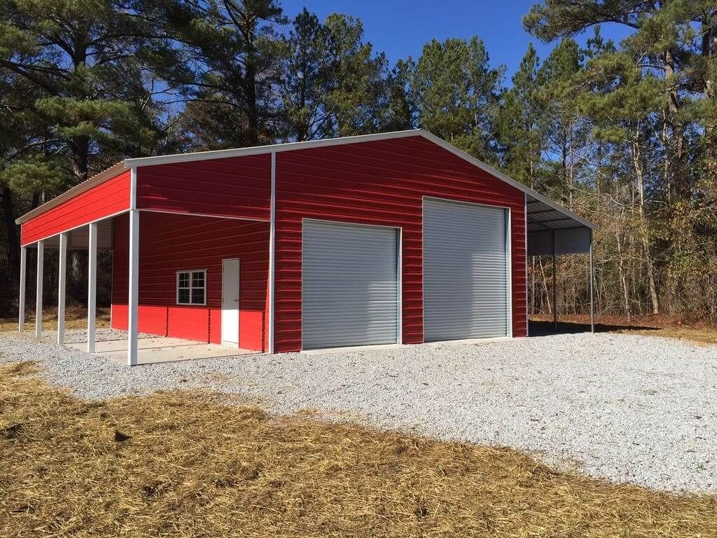 A red building with a garage and a carport