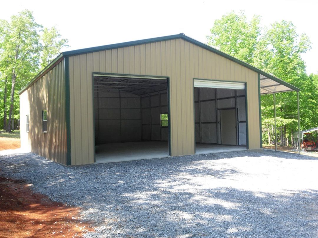 A truck is parked in a garage with the doors open