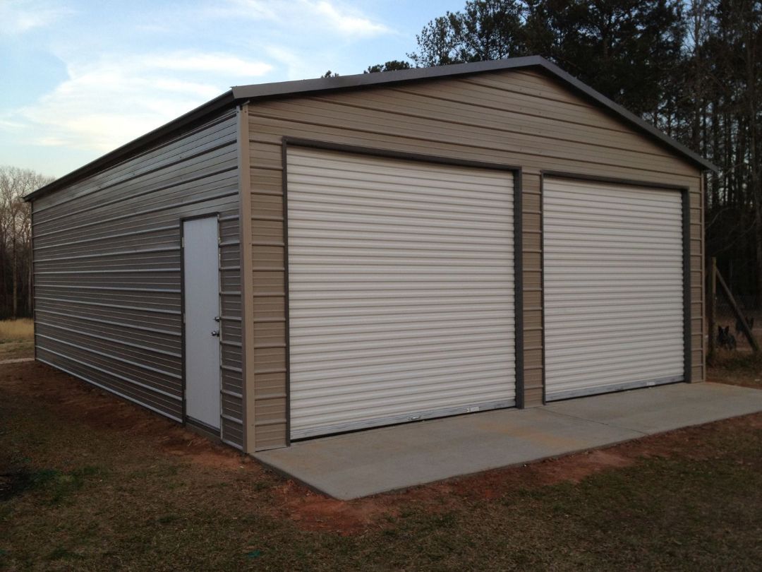 A garage with two garage doors and a door