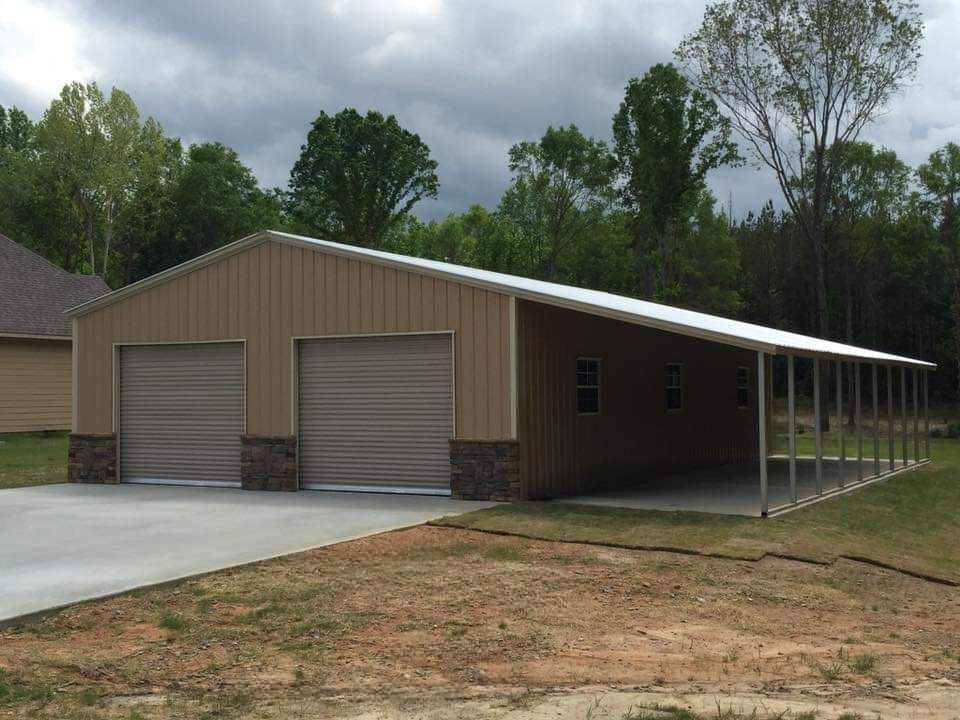 A garage with two garage doors and a porch.