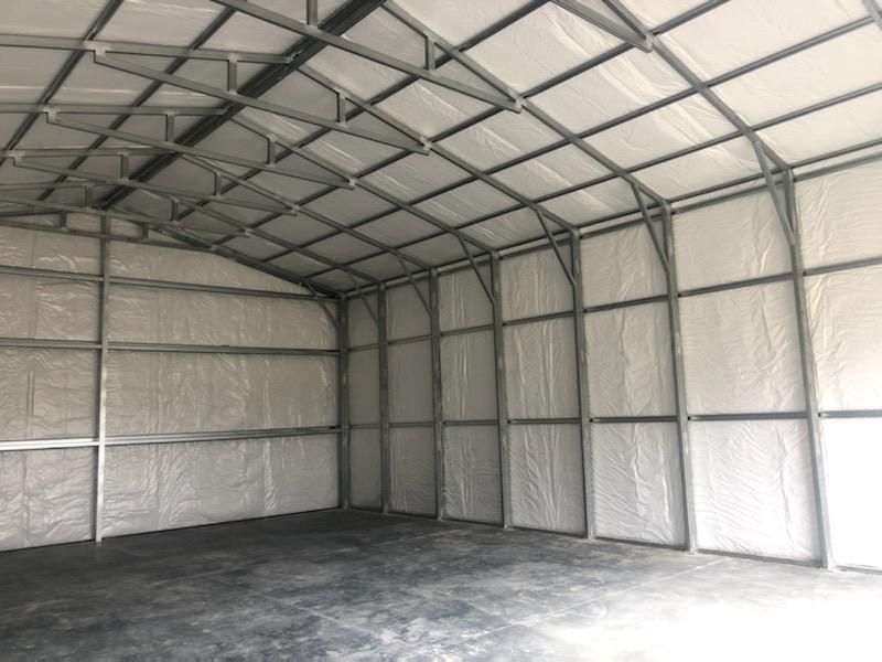 The inside of an empty garage with a concrete floor