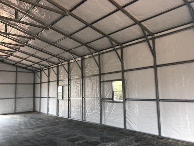 The inside of a building with a lot of insulation on the walls and ceiling.