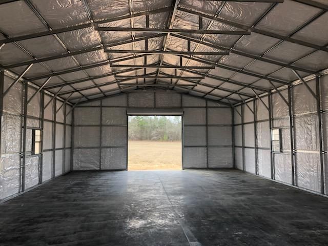 The inside of an empty building with a sliding door.