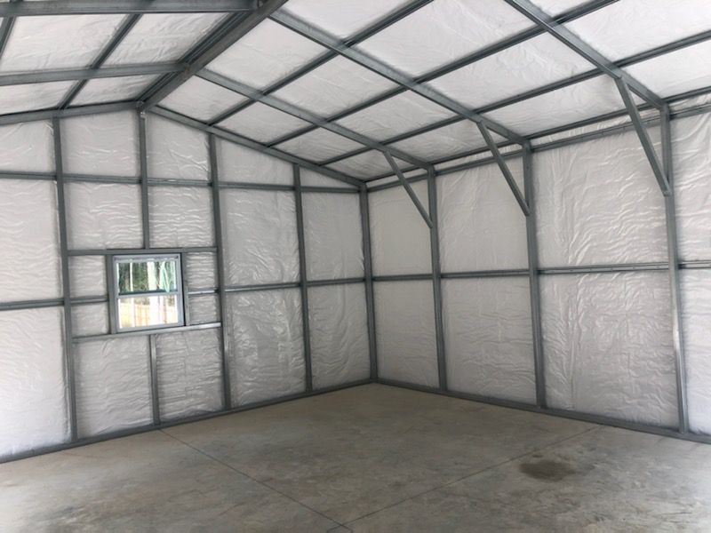 An empty room with a window and a white ceiling