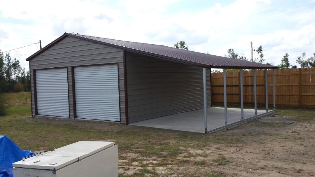 A garage with a porch and a car parked in front of it.