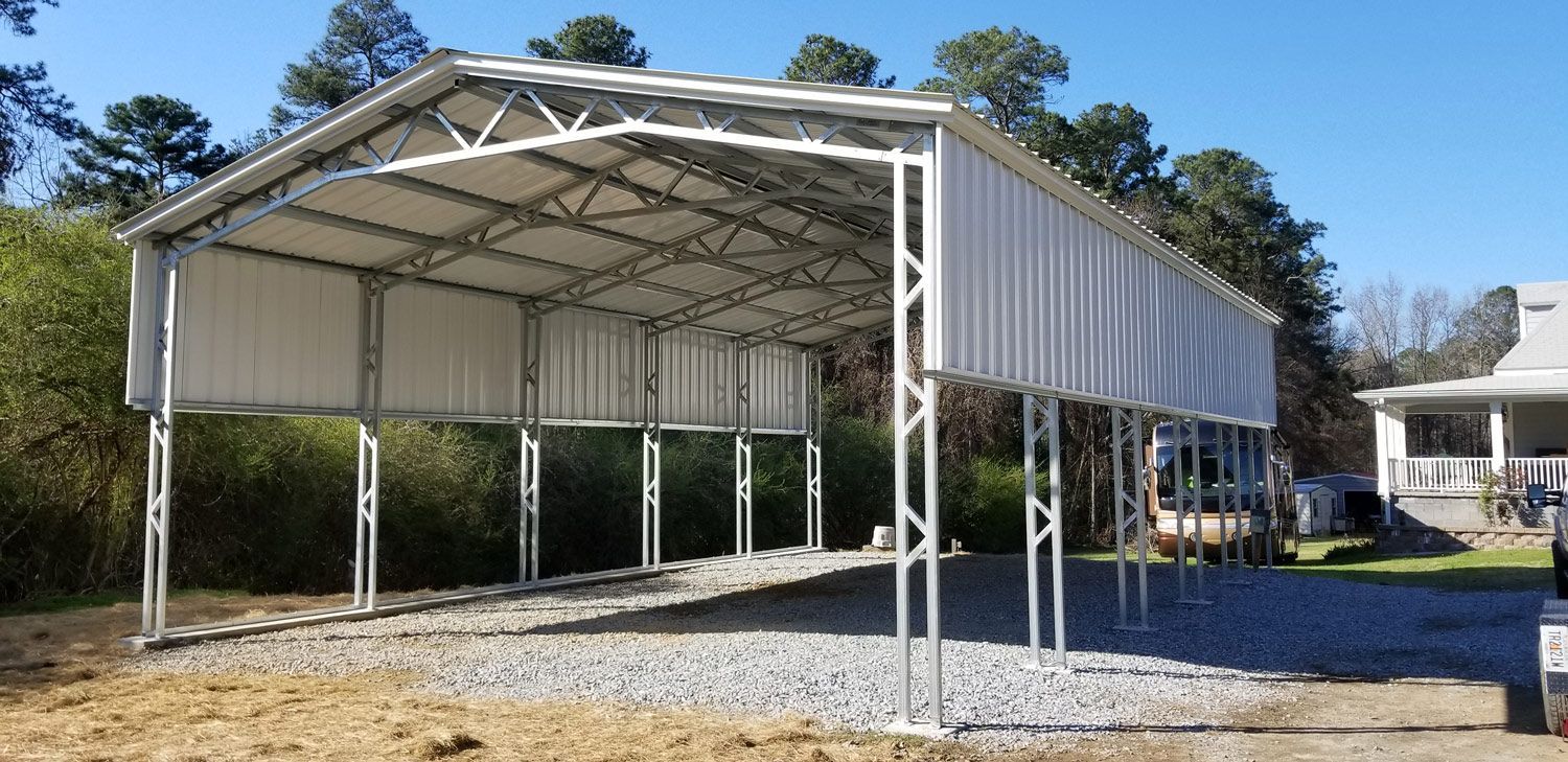 A carport is being built in the backyard of a house.