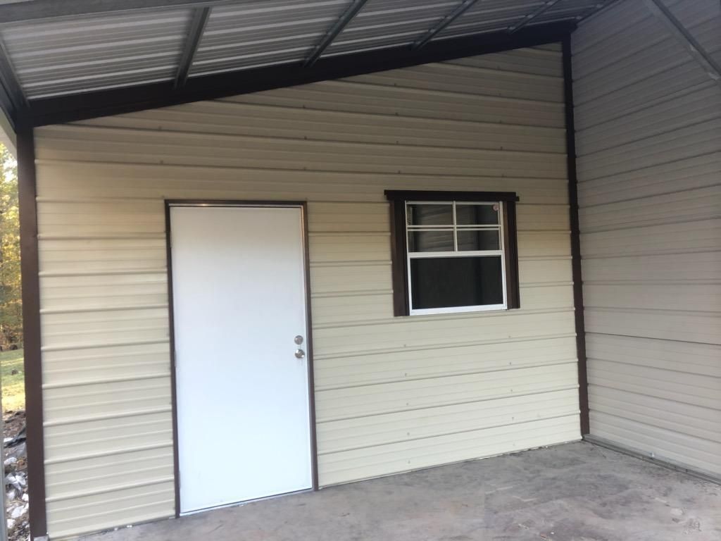 A garage with a white door and a window