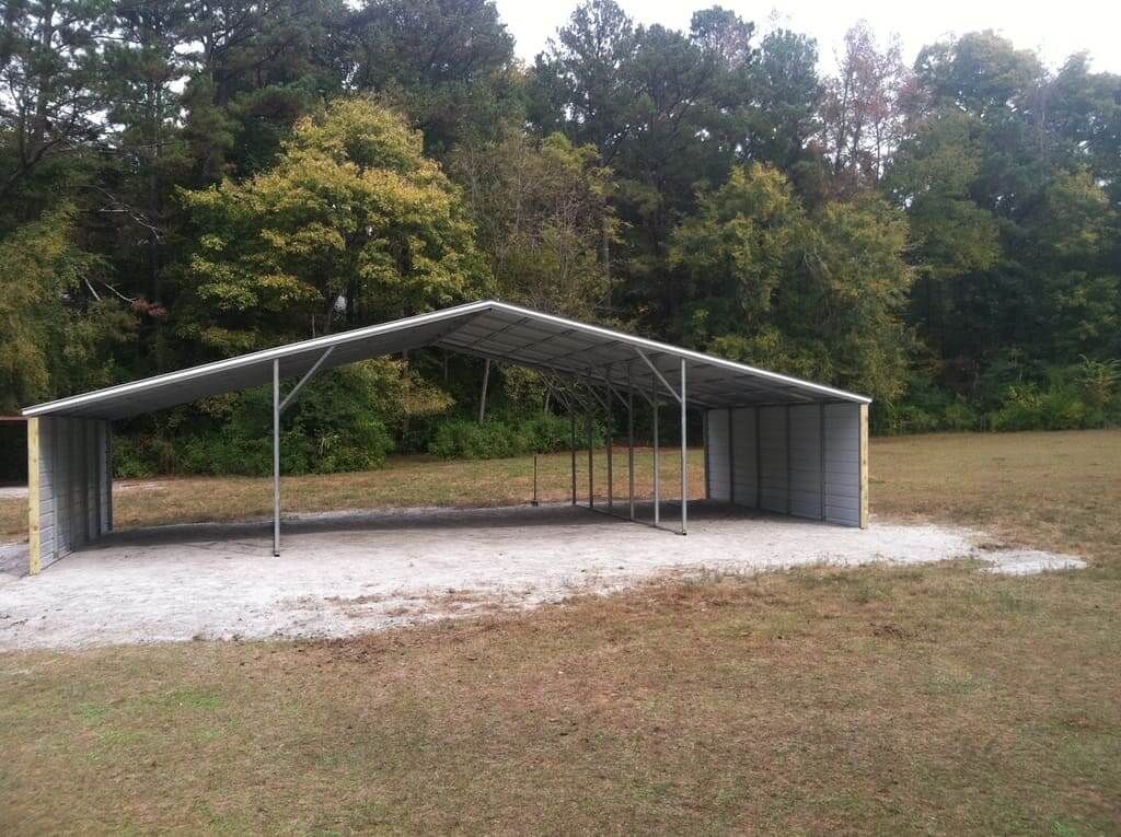 A large metal structure in the middle of a grassy field
