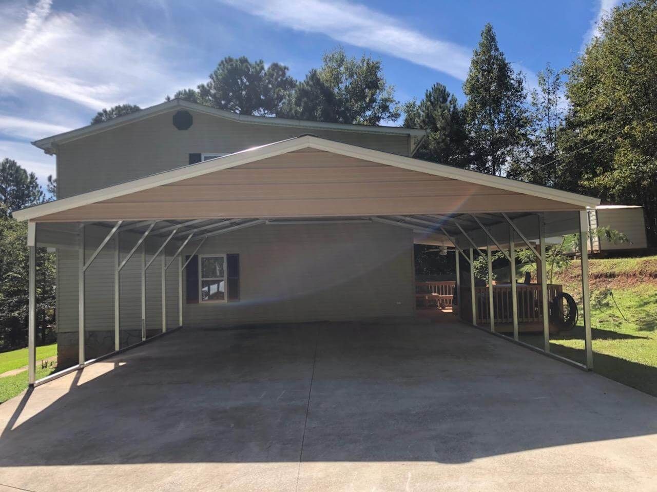 There is a carport in front of a house.