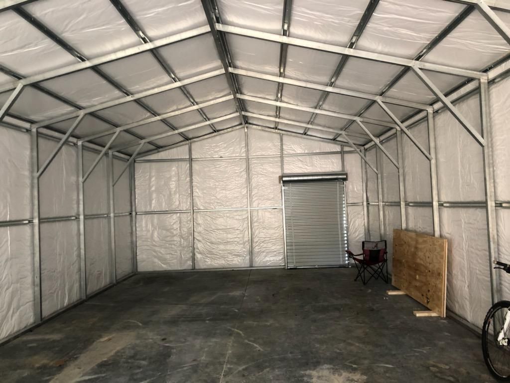 A bicycle is parked inside of a garage.