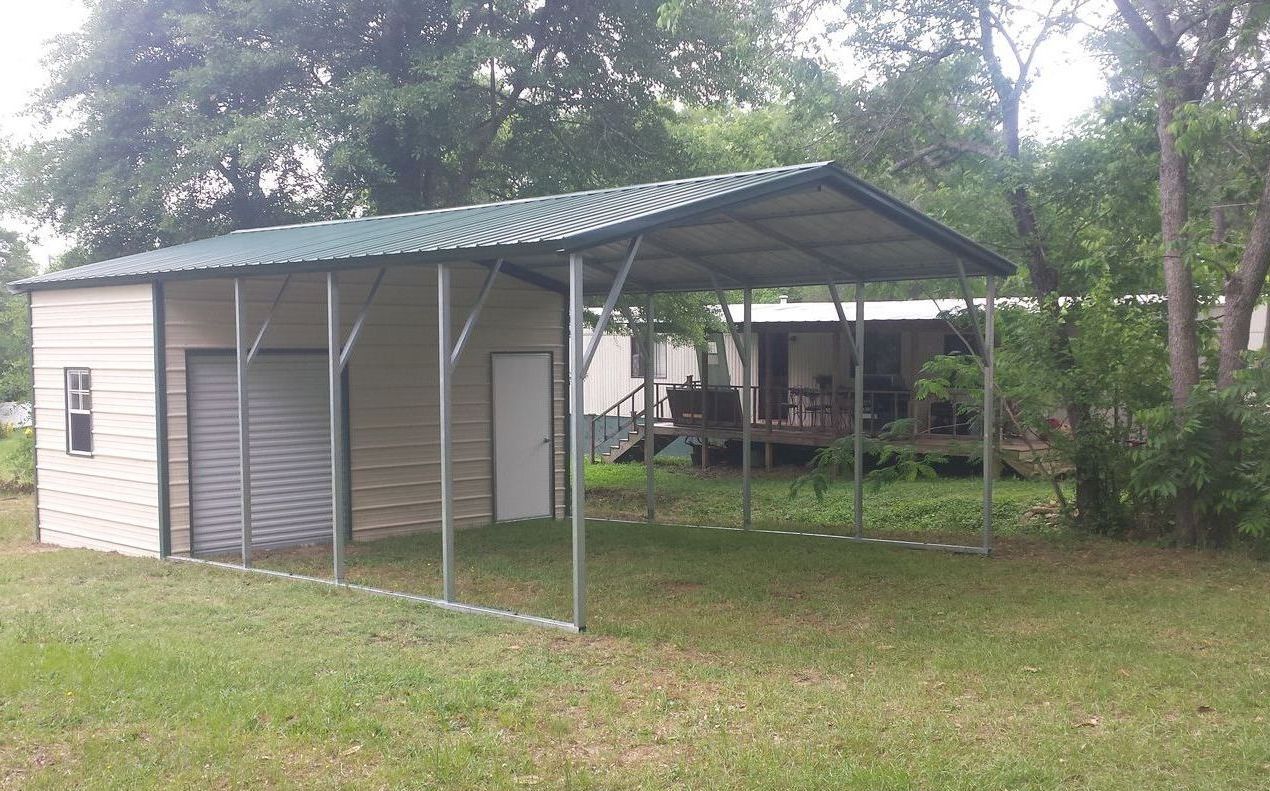 There is a garage with a carport attached to it.