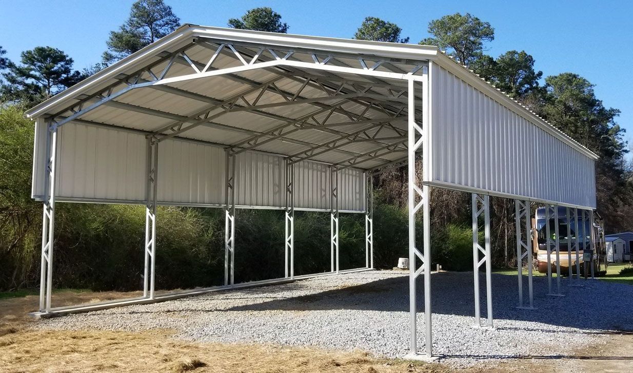 A carport is being built in the backyard of a house.