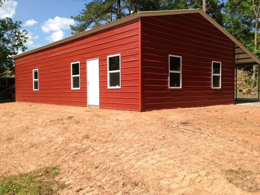 A red building with a white door and windows