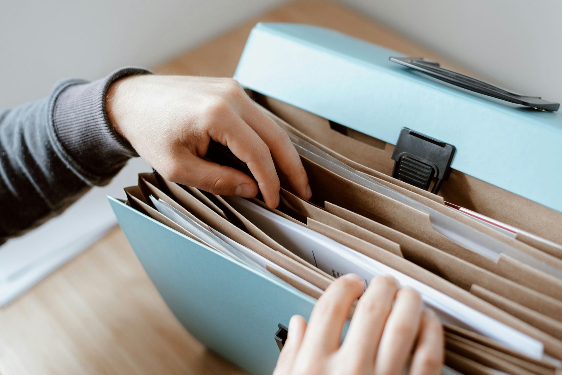 sifting through paperwork at ripple and root therapy in colorado
