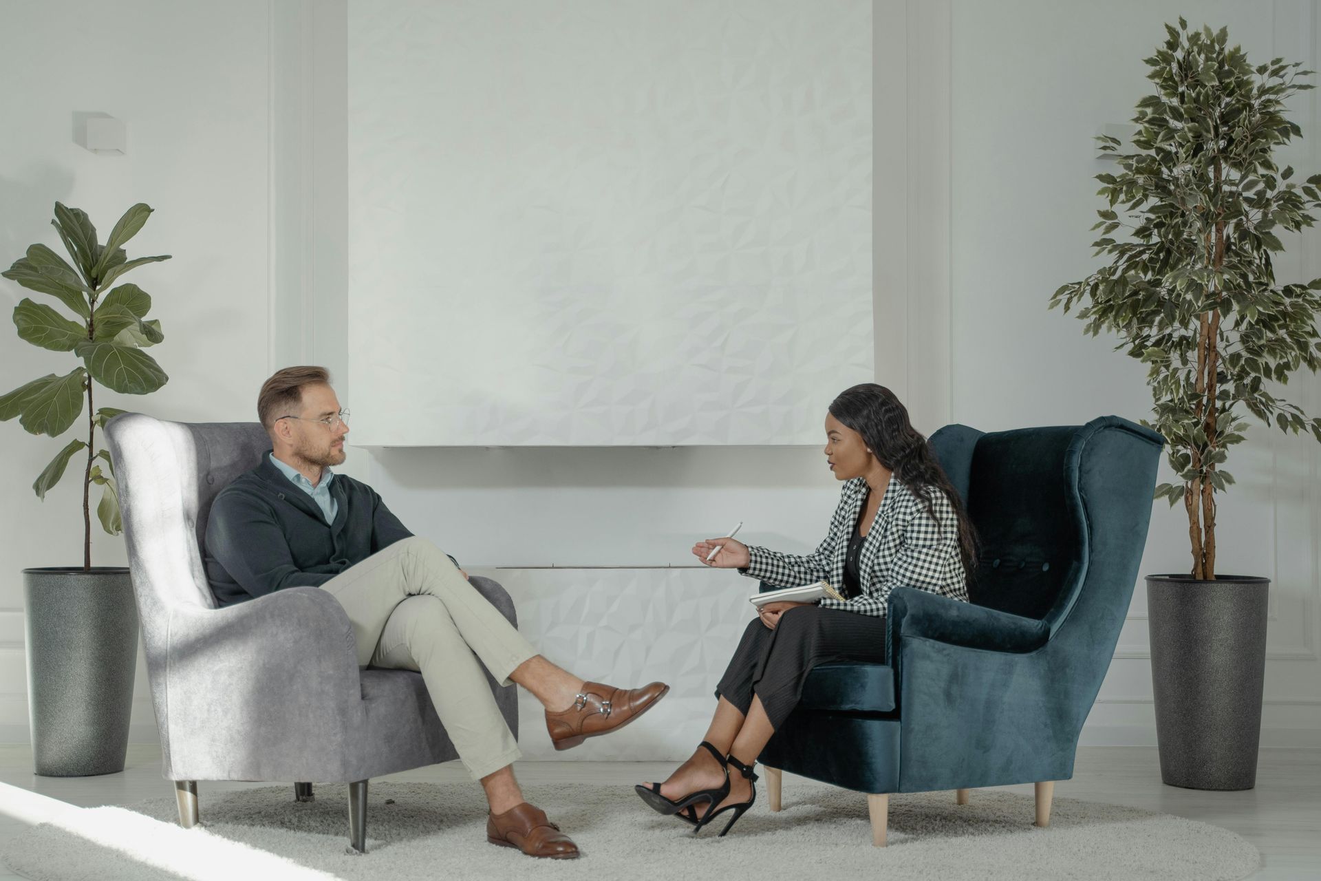 talking to a therapist on a chair at ripple and root therapy in colorado