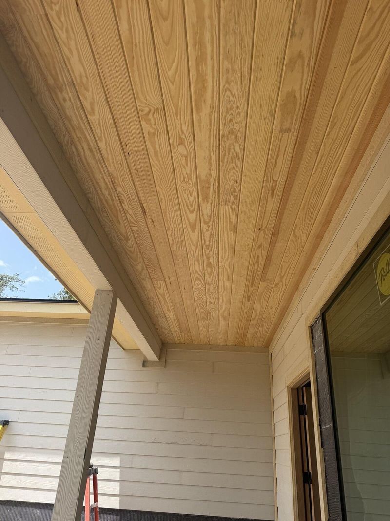 Finished covered porch with tongue-and-groove ceiling and steel column