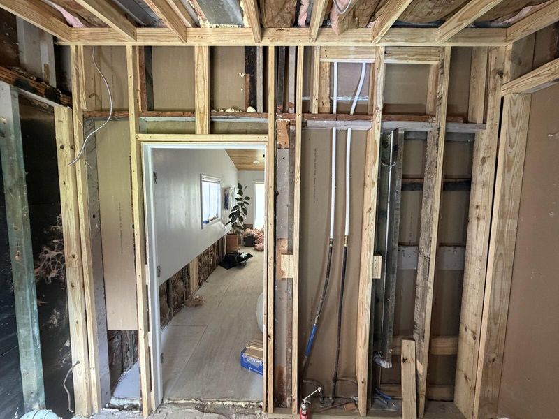 Interior framing and plumbing rough-in during a whole home remodeling project in Austin, TX
