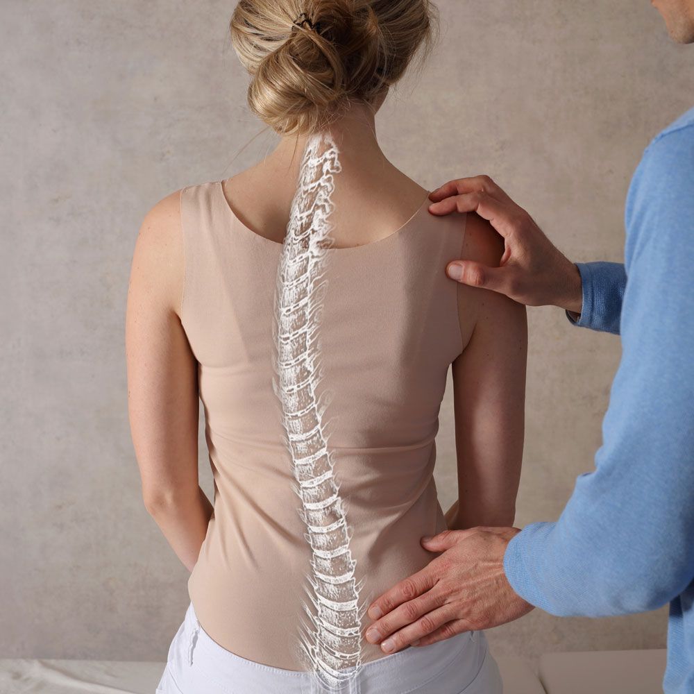 Examining Patient's Spine — Charlotte, NC — Accident & Injury Center