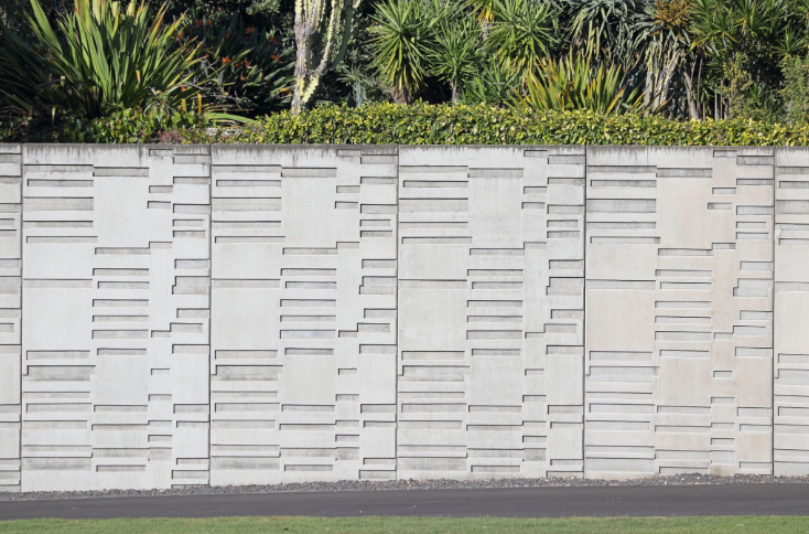 “Decorative white concrete wall with a clean geometric block pattern by a concrete contractor in Casas Adobes, AZ”