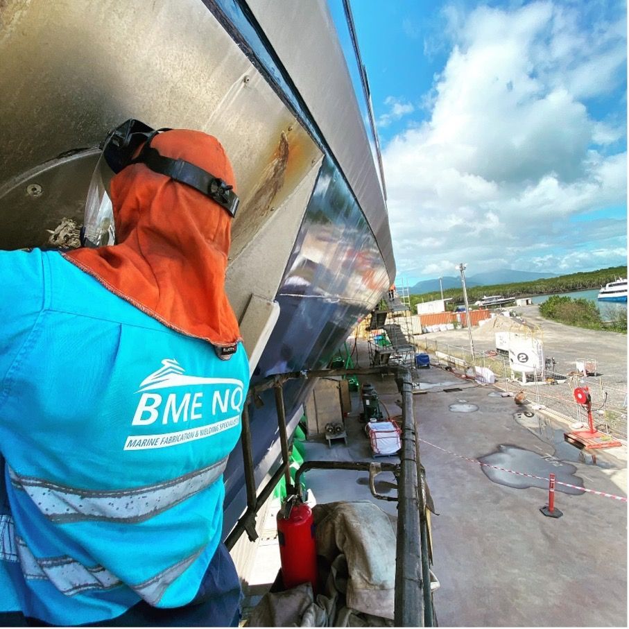 Boat is Sitting in a Warehouse With a Wooden Deck — BME NQ in Portsmith, QLD