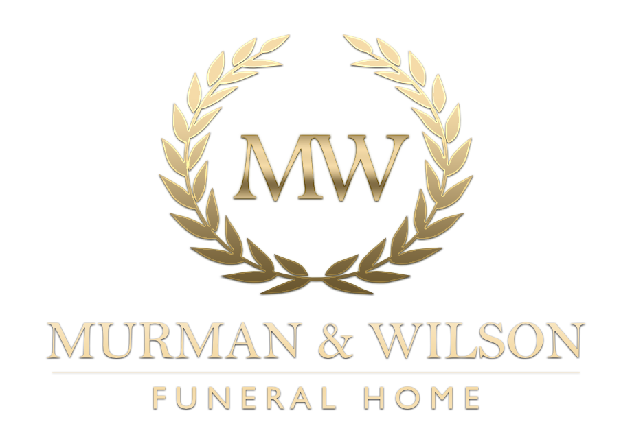 Murman & Wilson Funeral Home logo with gold laurel wreath and MW initials on white background