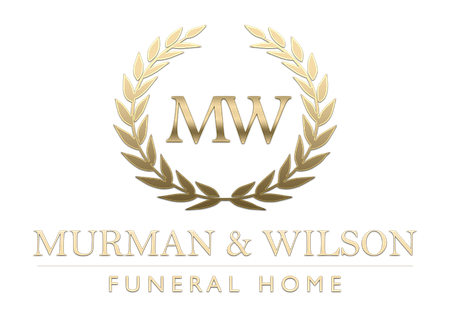 Murman & Wilson Funeral Home logo with gold laurel wreath and MW initials on white background