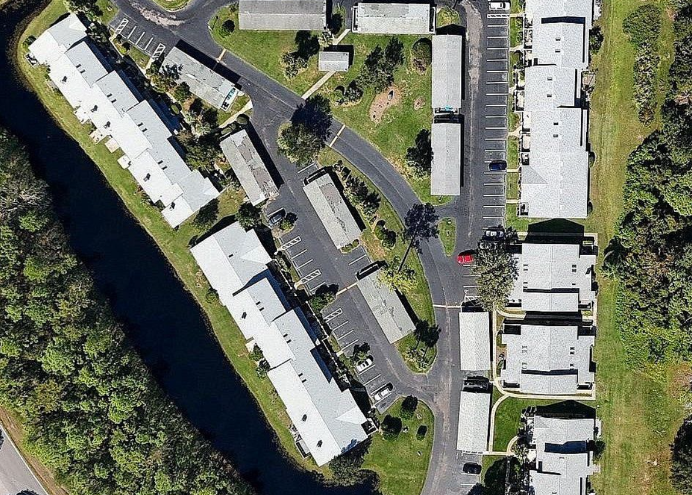 An aerial view of a building with a black roof